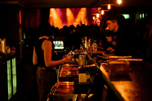 A bartender serving a customer